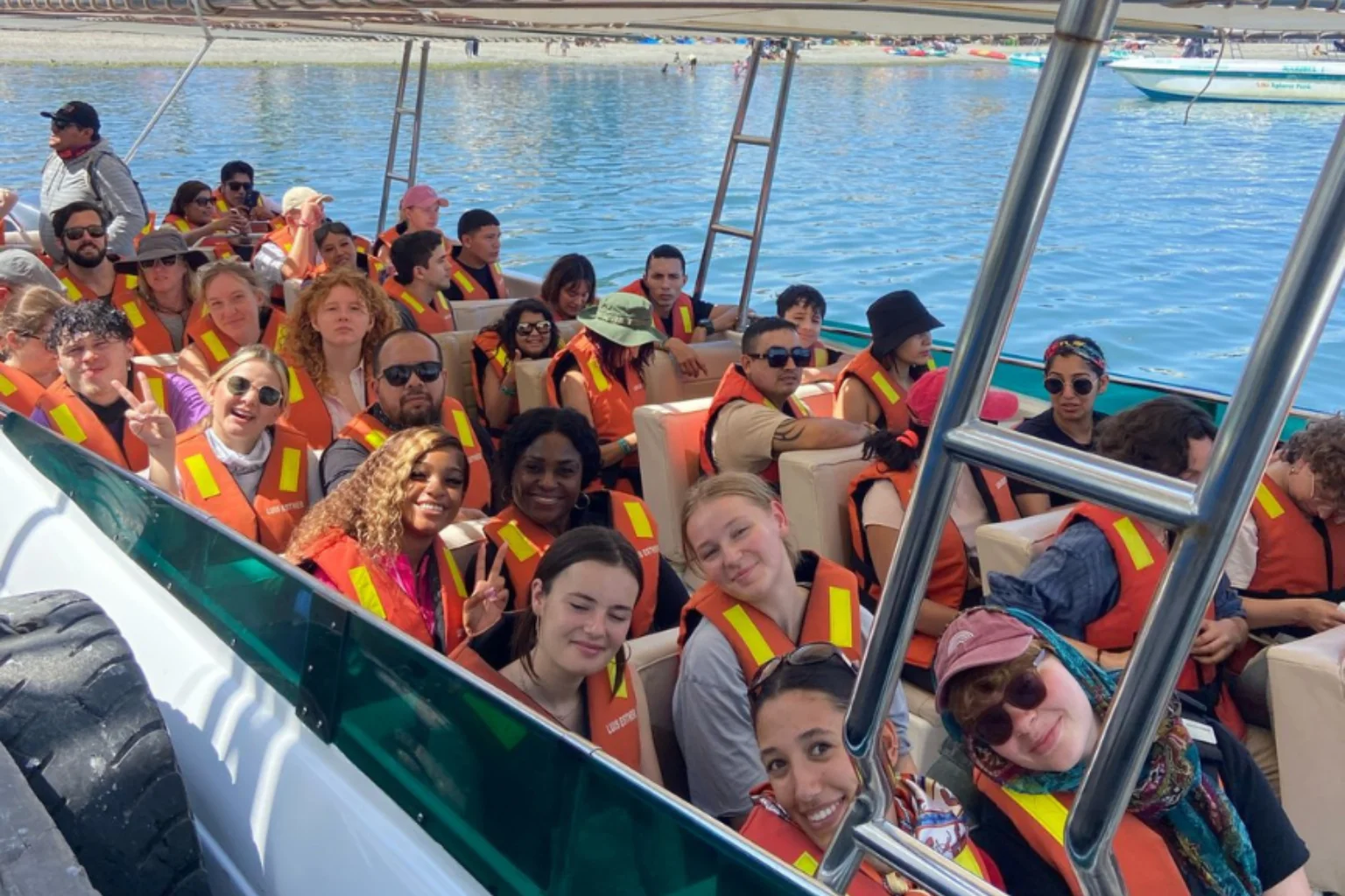 Group of Travelers in a boat heading the Ballestas Island - Lima to Paracas Bus - Wayki Bus