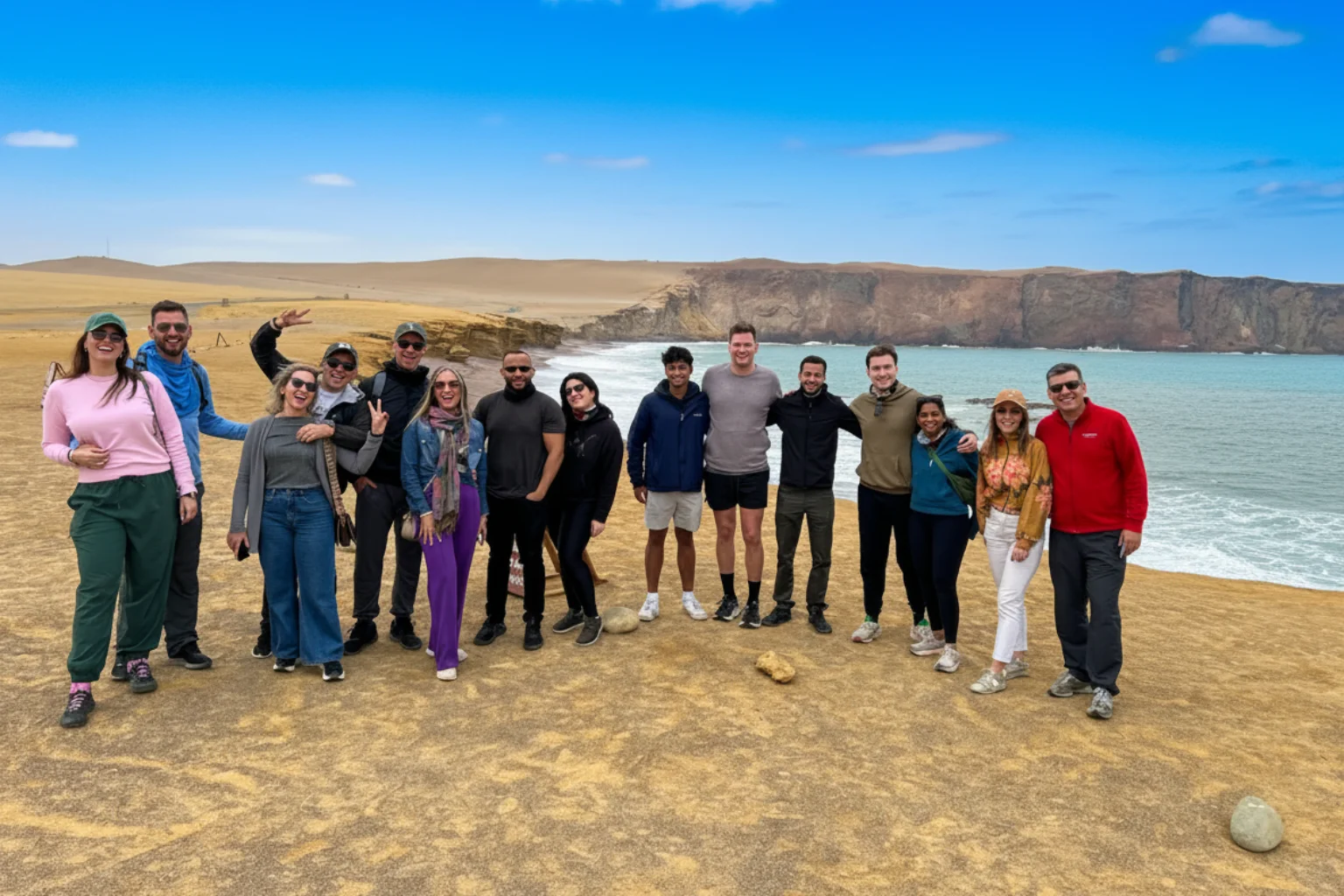 Group of happy travelers during the Paracas National Reserve tour - Lima to Paracas Bus - Wayki Bus