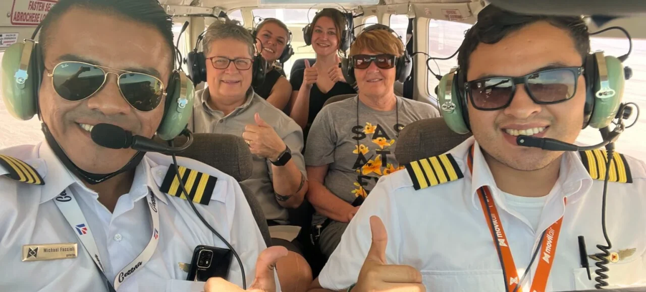 Group of travelers flying over the Nazca Lines - Bus from Huacachina to Nazca - Wayki Bus