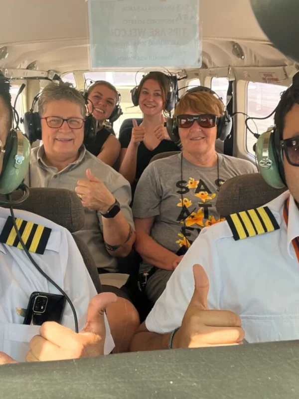 Group of travelers flying over the Nazca Lines - Bus from Huacachina to Nazca - Wayki Bus
