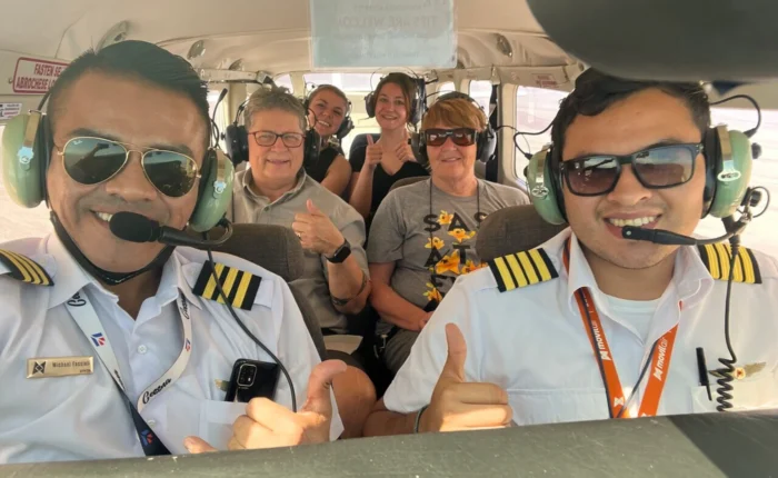 Group of travelers flying over the Nazca Lines - Bus from Huacachina to Nazca - Wayki Bus