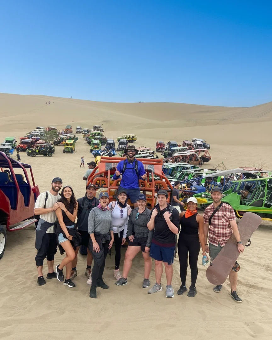 Group of Traveler having fun during the sandboarding tour in Huacachina - Wayki Bus