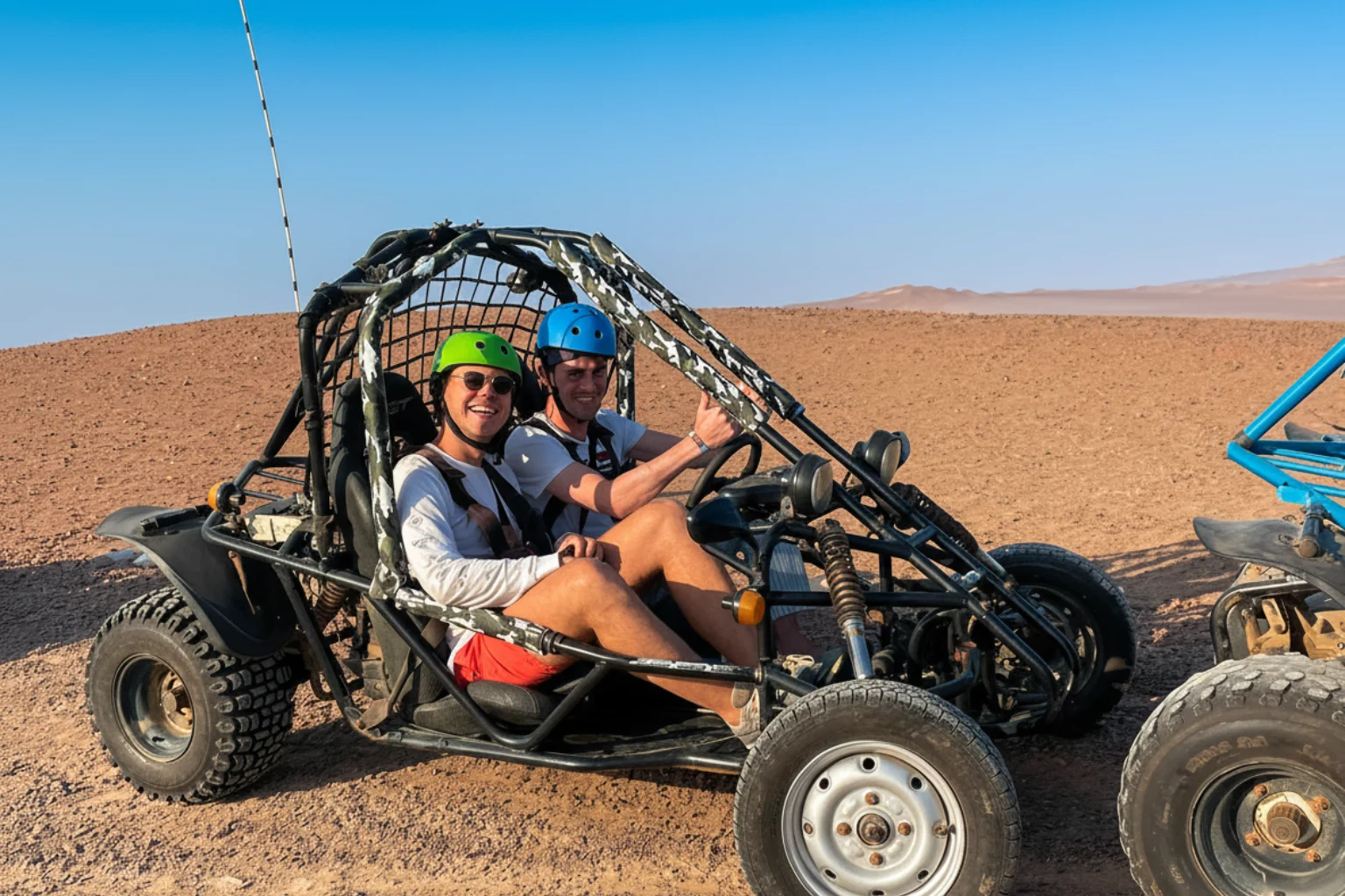 Travelers having fun during the mini buggy desert adventure tiur in Paracas - Wayki Bus